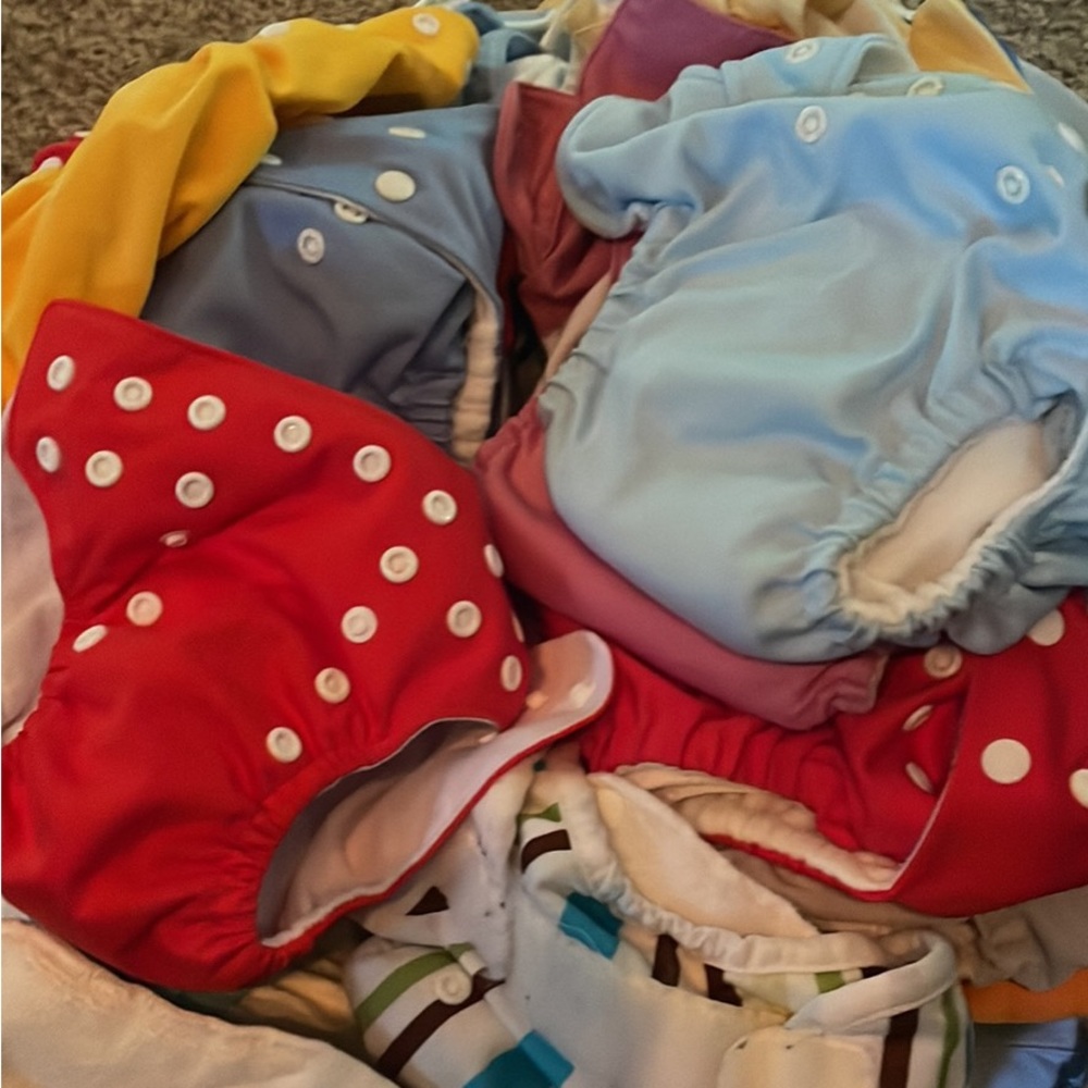 Giant lot of Gently used cloth diapers. 15. Inludes outers and inners.
